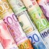 A backgrounds with colorful of many roll currency,money from many country