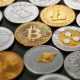 Collection from different coins of crypto currency, pattern from a ethereum, litecoin, bitcoin, monero, ripple, dash on dark background. Cryptocurrency and blockchain trading concept.